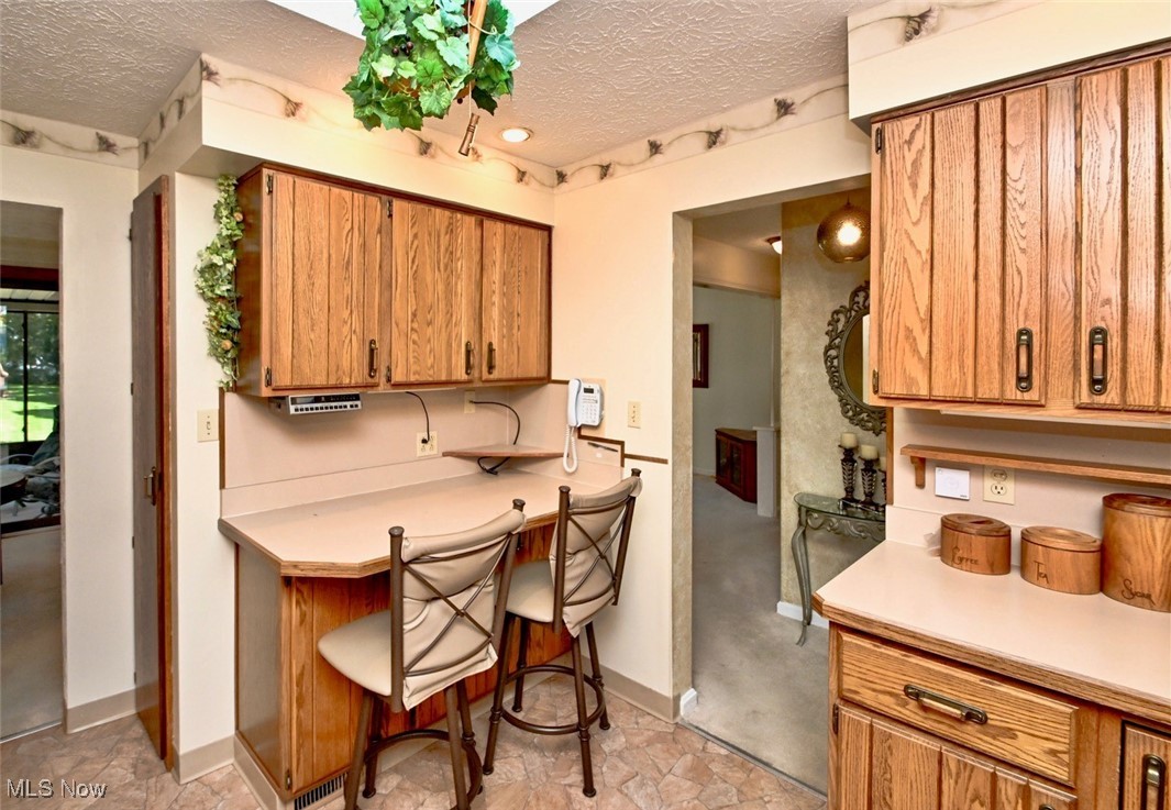 5653 Dailey Road New Franklin, OH 44319 - Photo 16 of 24 Kitchen with a textured ceiling