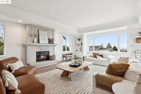 a living room with furniture or couch and a large window