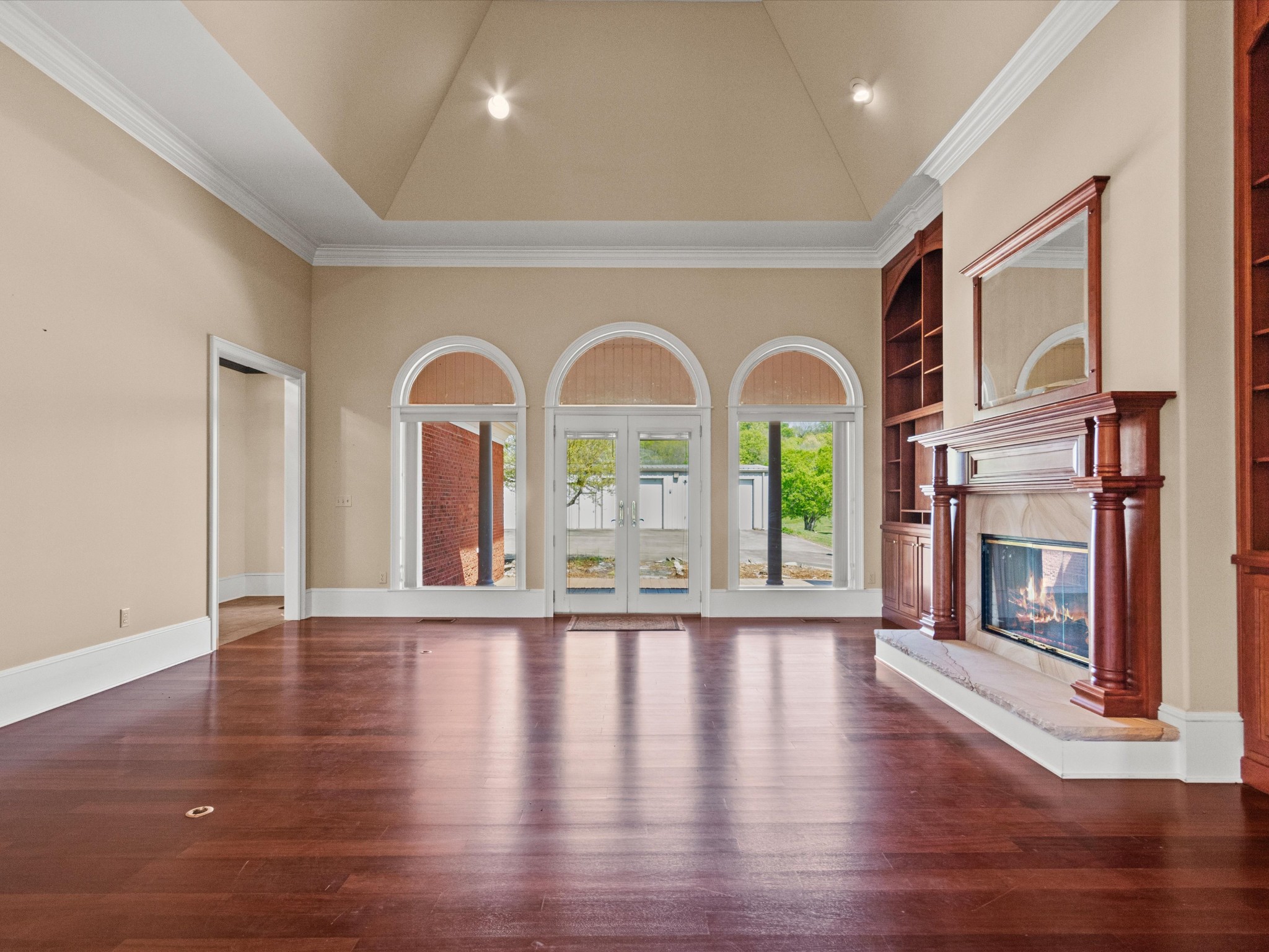 954 Molino Road Taft, TN 38488 - Photo 13 of 64 a view of empty room with wooden floor and fireplace