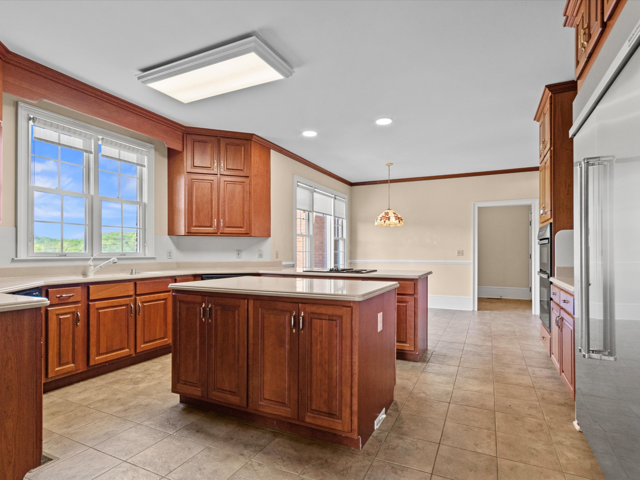 954 Molino Road Taft, TN 38488 - Photo 16 of 64 a kitchen with stainless steel appliances granite countertop a sink and dishwasher a refrigerator with wooden cabinets