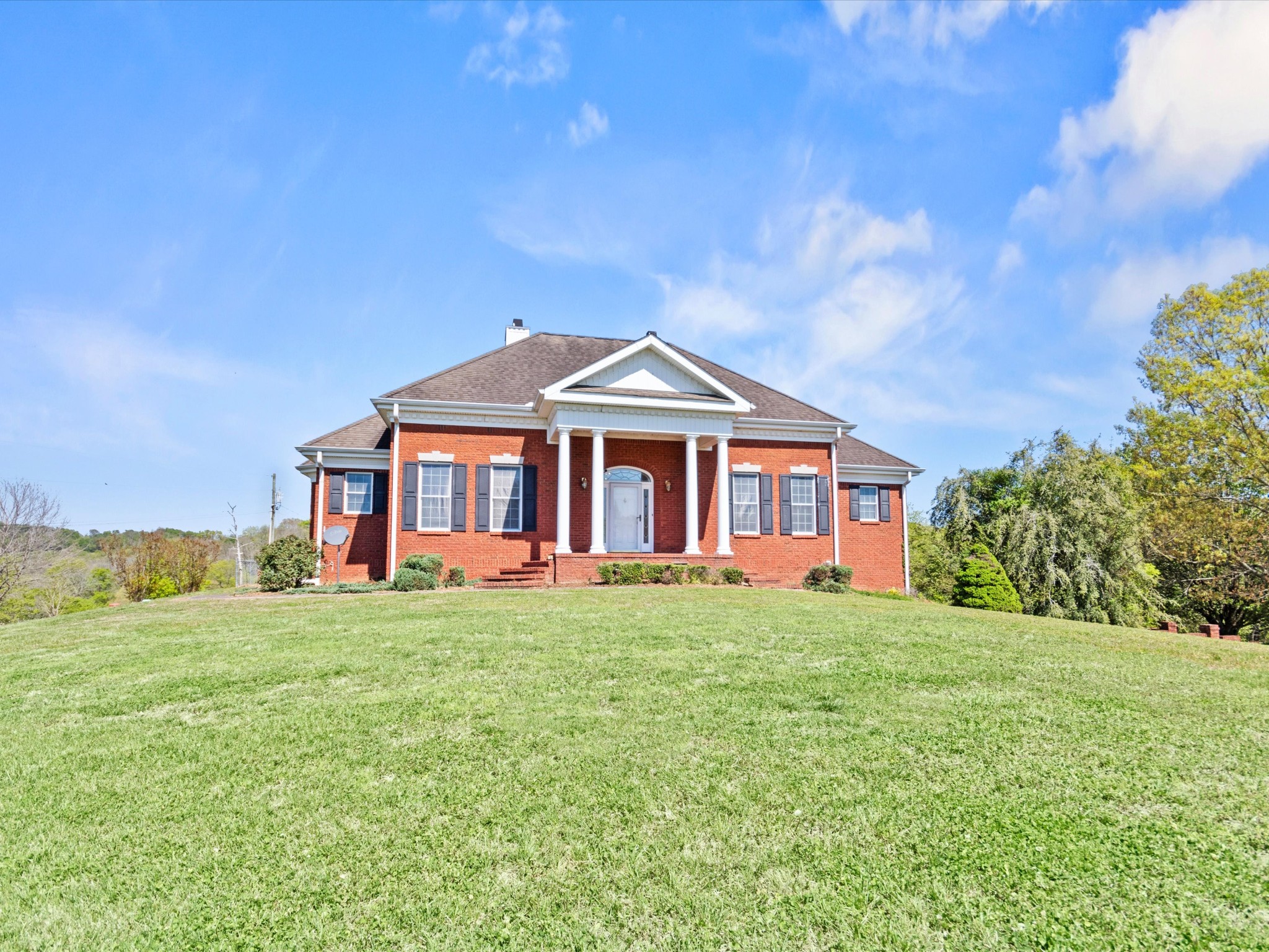 954 Molino Road Taft, TN 38488 - Photo 2 of 64 a front view of a house with a yard