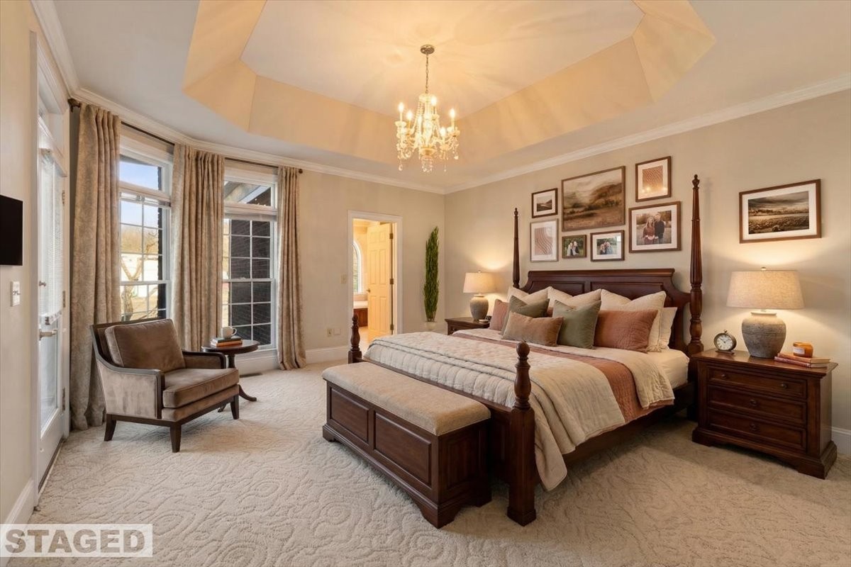 954 Molino Road Taft, TN 38488 - Photo 23 of 64 a spacious bedroom with a bed a couch and large windows
