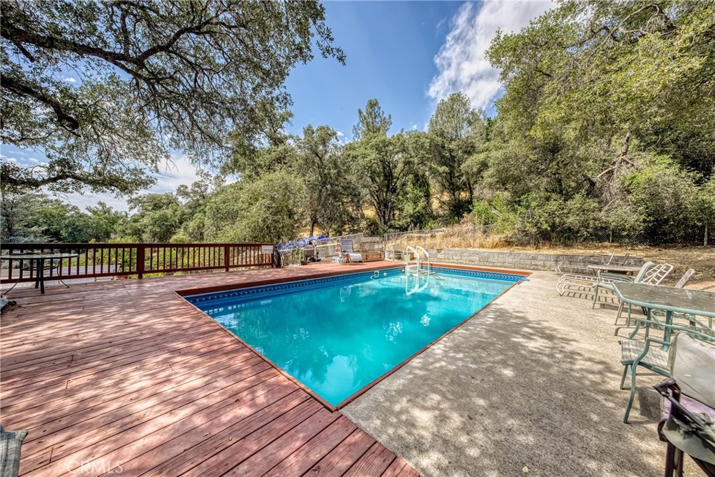 2976 Rancho Vista Drive Lucerne, CA 95458 - Photo 13 of 51 view of a swimming pool with an outdoor seating