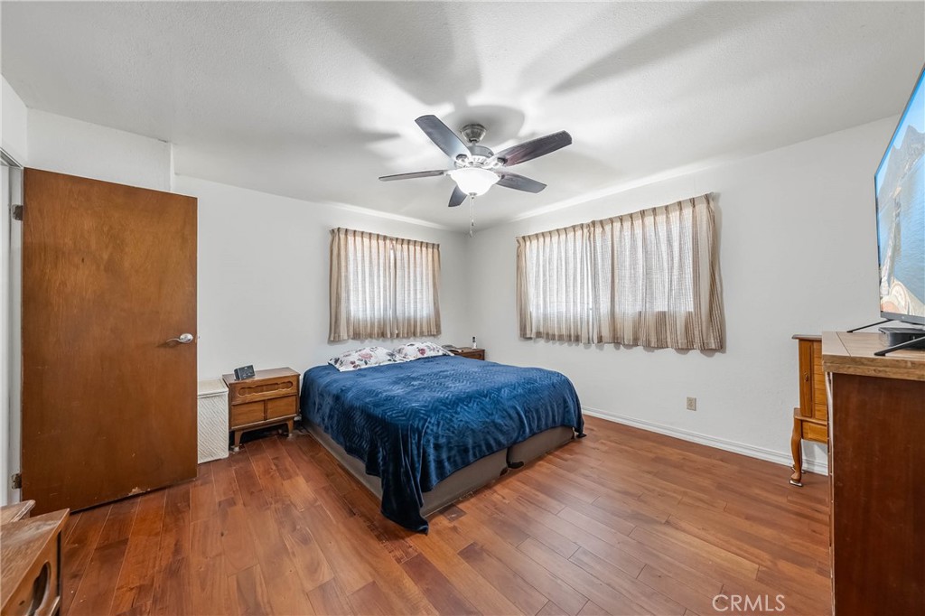 2976 Rancho Vista Drive Lucerne, CA 95458 - Photo 14 of 51 a spacious bedroom with a bed and a ceiling fan