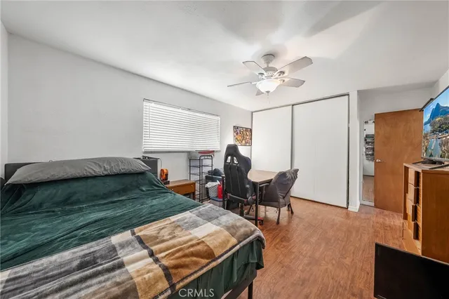 a bedroom with a bed and a table in it