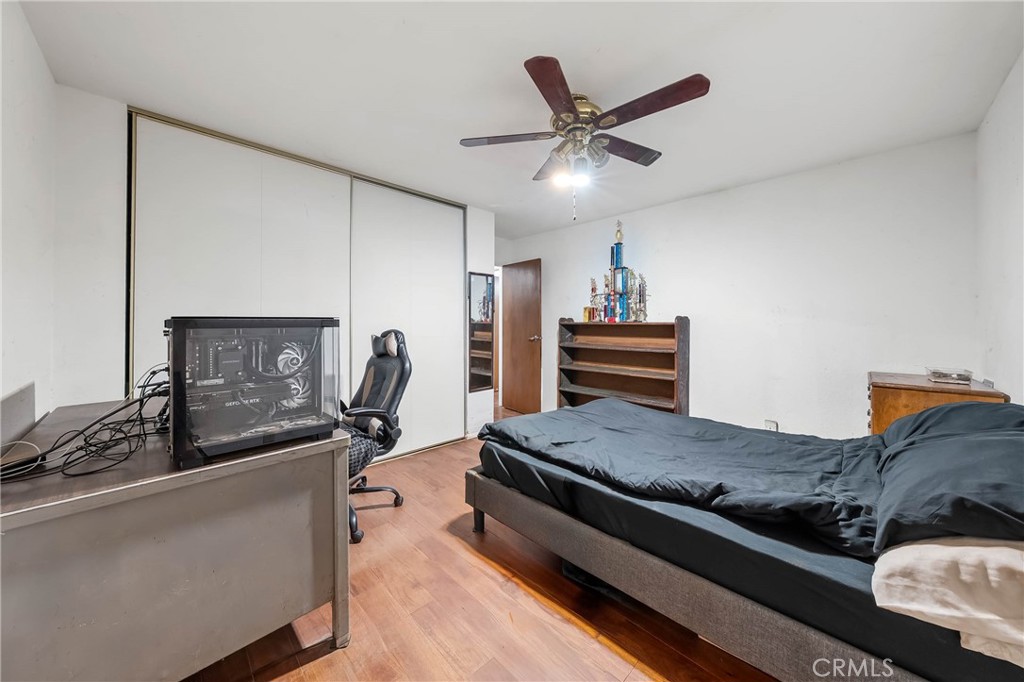 2976 Rancho Vista Drive Lucerne, CA 95458 - Photo 24 of 51 a bedroom with a bed and wooden floor