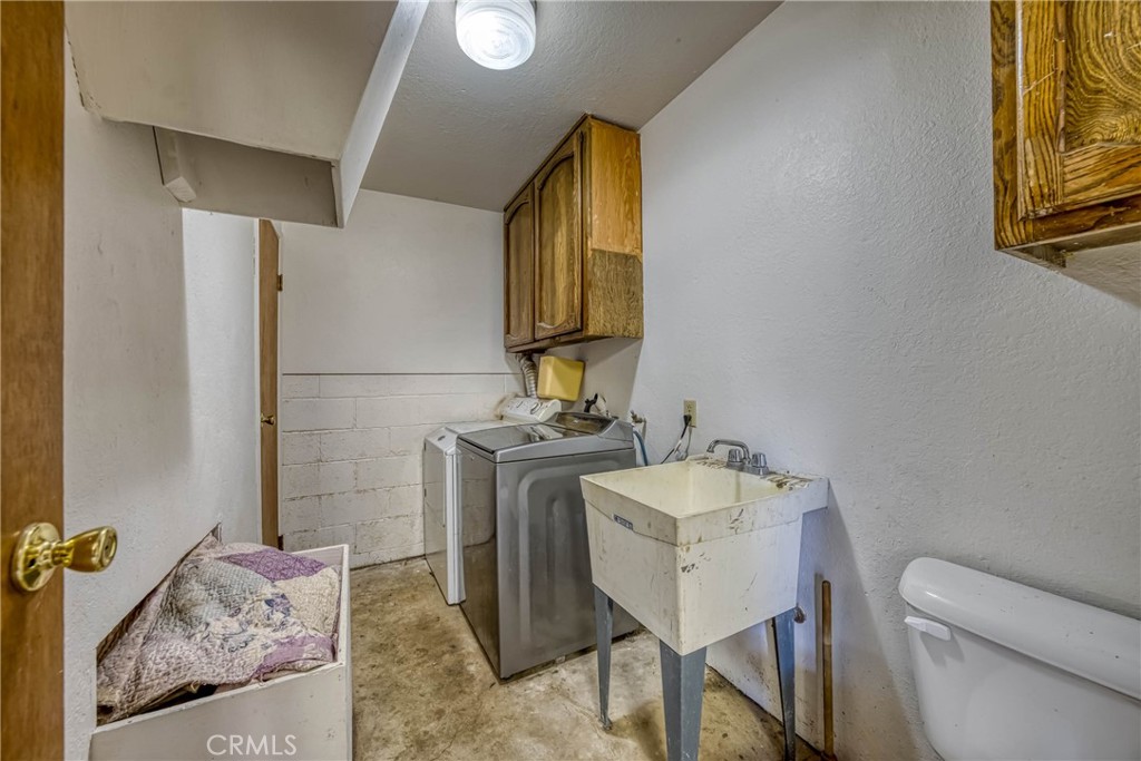 2976 Rancho Vista Drive Lucerne, CA 95458 - Photo 26 of 51 a bathroom with a granite countertop toilet sink and mirror