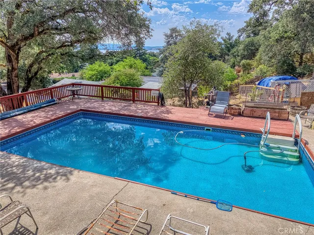 a view of a backyard with sitting area