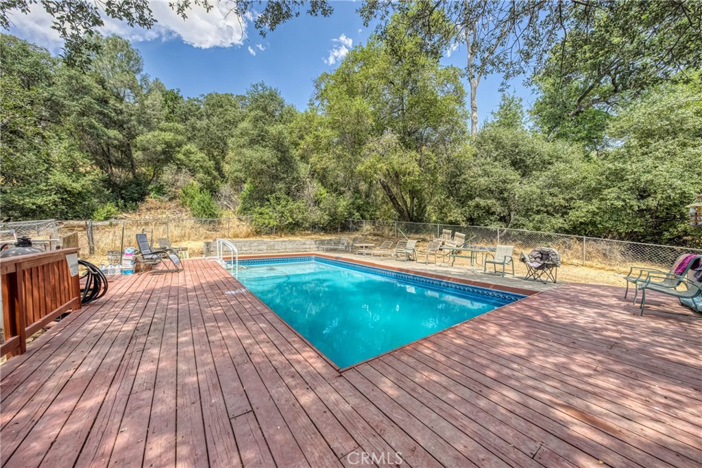 2976 Rancho Vista Drive Lucerne, CA 95458 - Photo 45 of 51 a view of a swimming pool with a lounge chairs