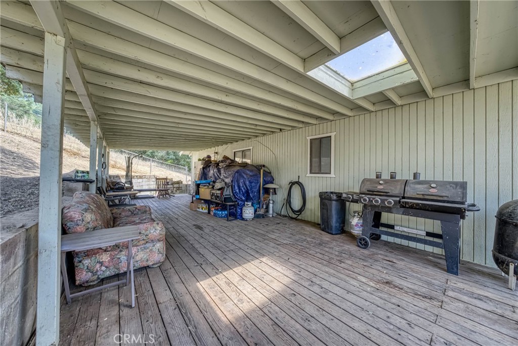 2976 Rancho Vista Drive Lucerne, CA 95458 - Photo 49 of 51 a view of a patio with table and chairs barbeque with wooden floor