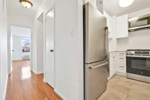 a view of a kitchen from the hallway
