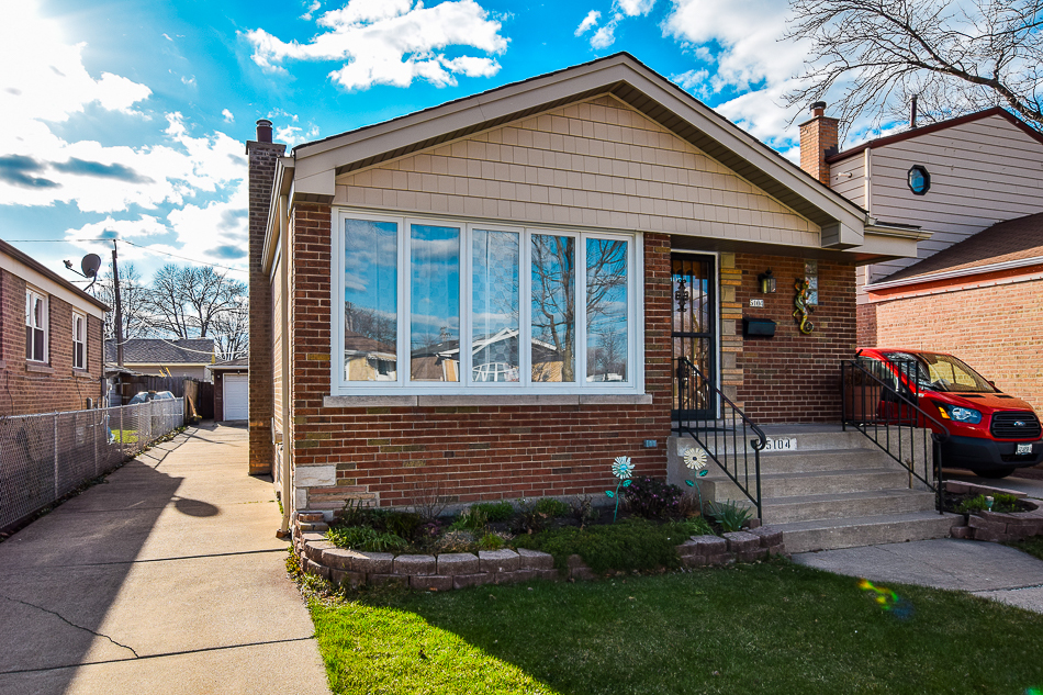 5104 South Rutherford Avenue Chicago, IL 60638 - Photo 1 of 23 a view of house with backyard