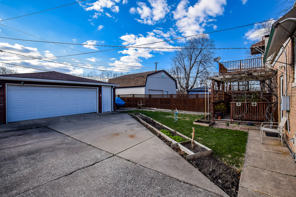 5104 South Rutherford Avenue Chicago, IL 60638 - Photo 23 of 23 a view of a house with a yard
