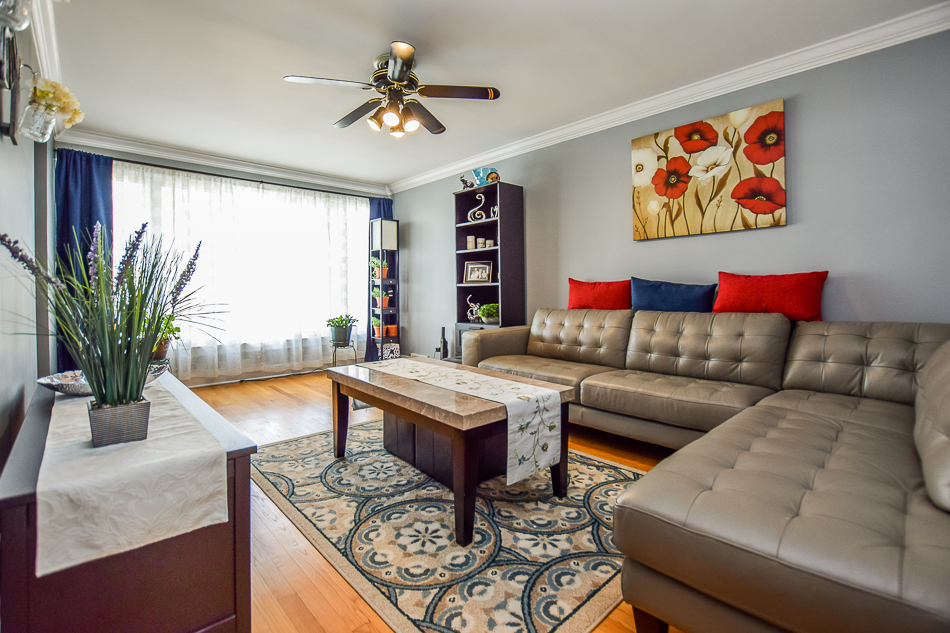 5104 South Rutherford Avenue Chicago, IL 60638 - Photo 4 of 23 a living room with furniture and a large window