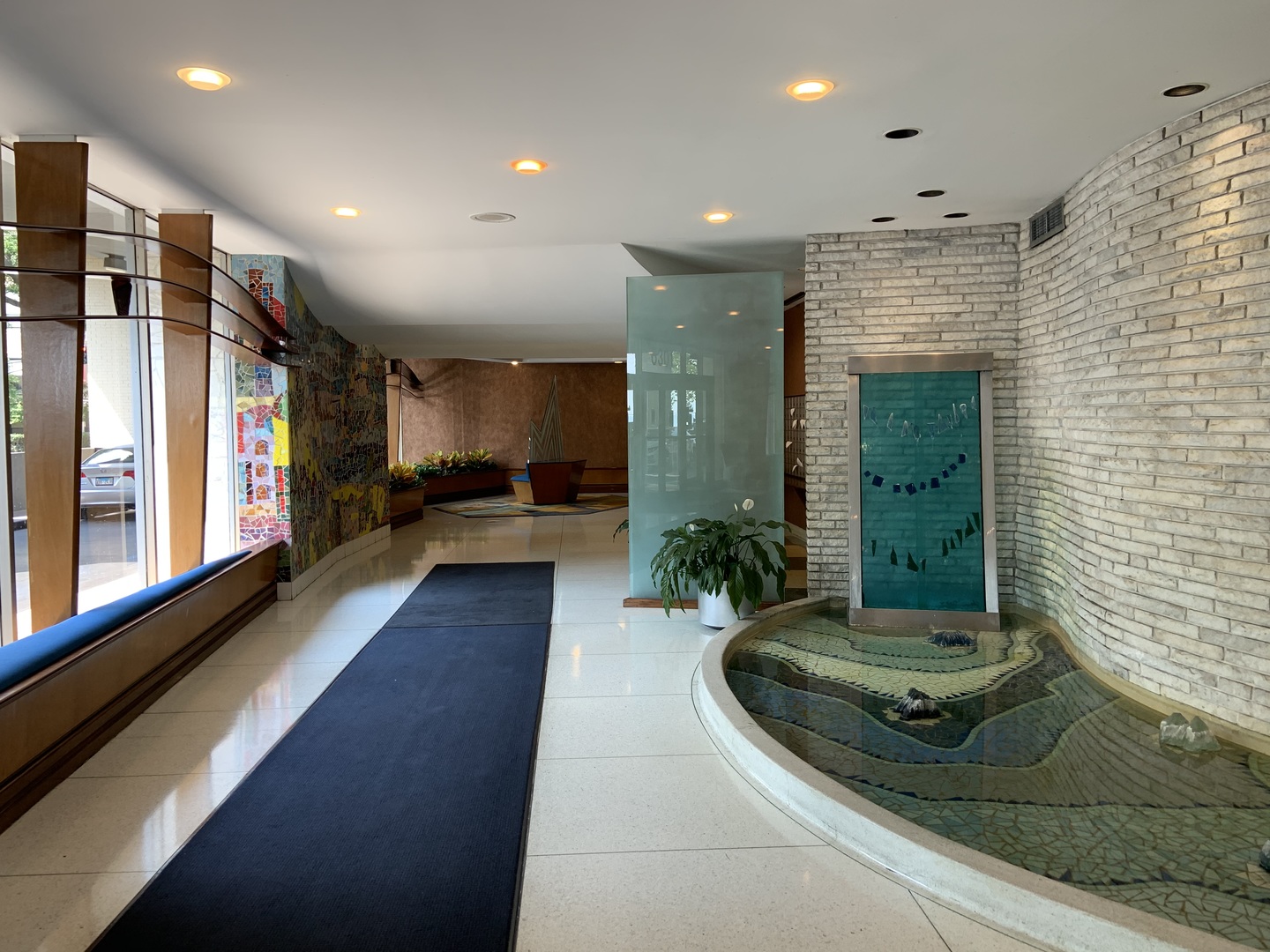 6301 North Sheridan Road, Unit 6L Chicago, IL 60660 - Photo 16 of 21 a view of a lobby with black carpet