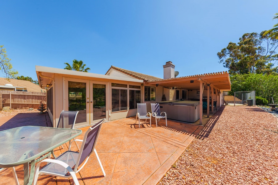9276 High Rise Way Santee, CA 92071 - Photo 16 of 24 Pebble-tech flooring under the covered patio, with stamped colored concrete continue the outdoor area for class and glamour!