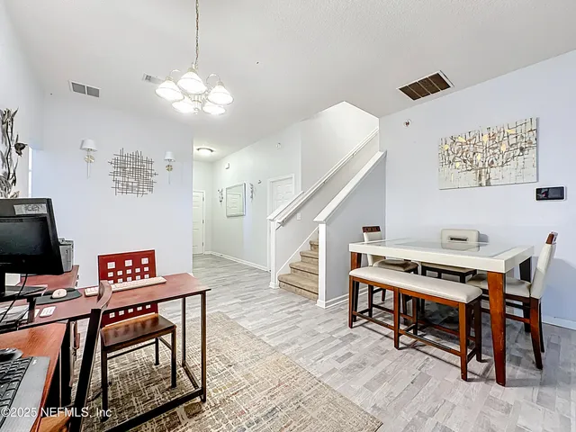 a workspace with furniture and a flat screen tv