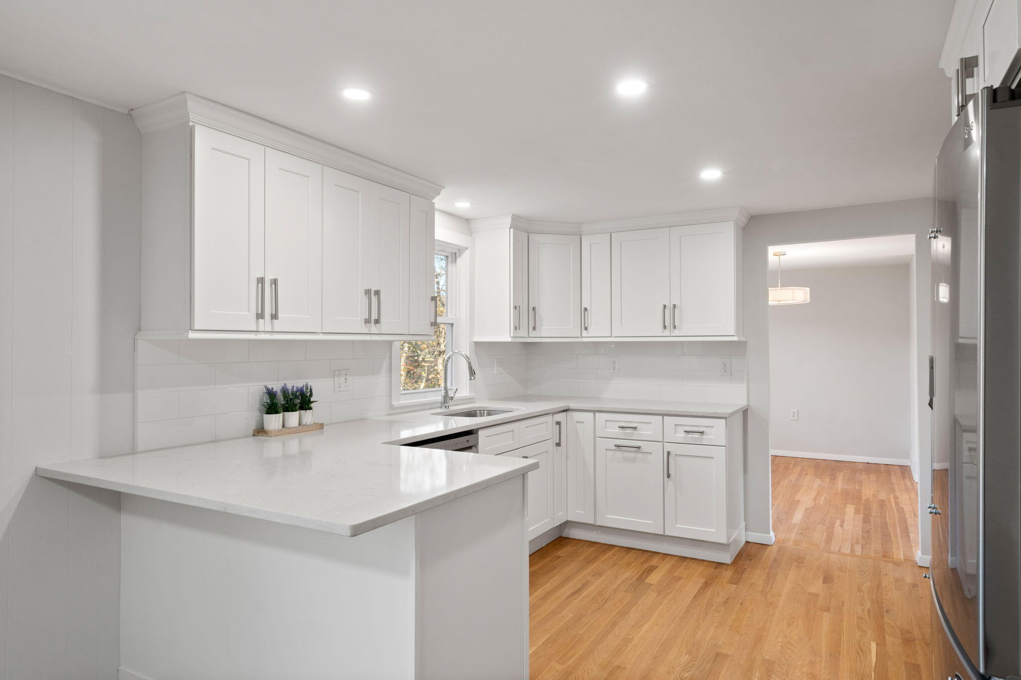 118 Fox Hill Road Centerville, MA 02632 - Photo 11 of 22 a kitchen with a sink cabinets and wooden floor