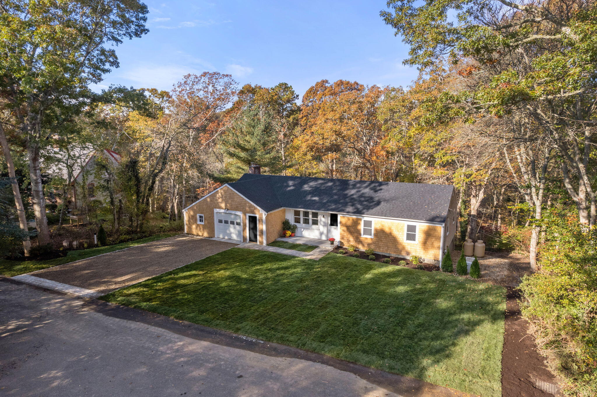 118 Fox Hill Road Centerville, MA 02632 - Photo 3 of 22 a front view of a house with a yard
