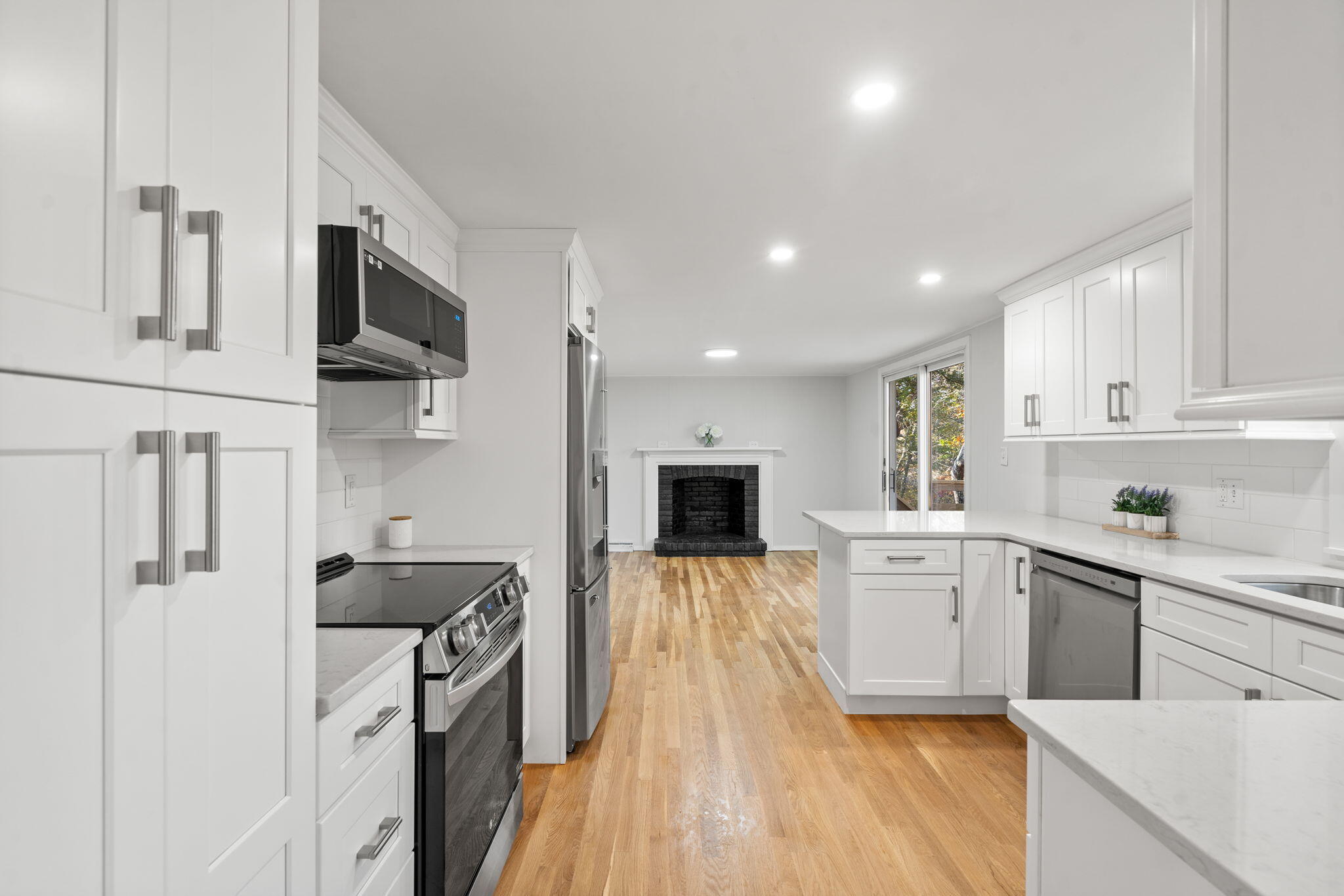 118 Fox Hill Road Centerville, MA 02632 - Photo 9 of 22 a kitchen with stainless steel appliances a stove sink microwave refrigerator and cabinets