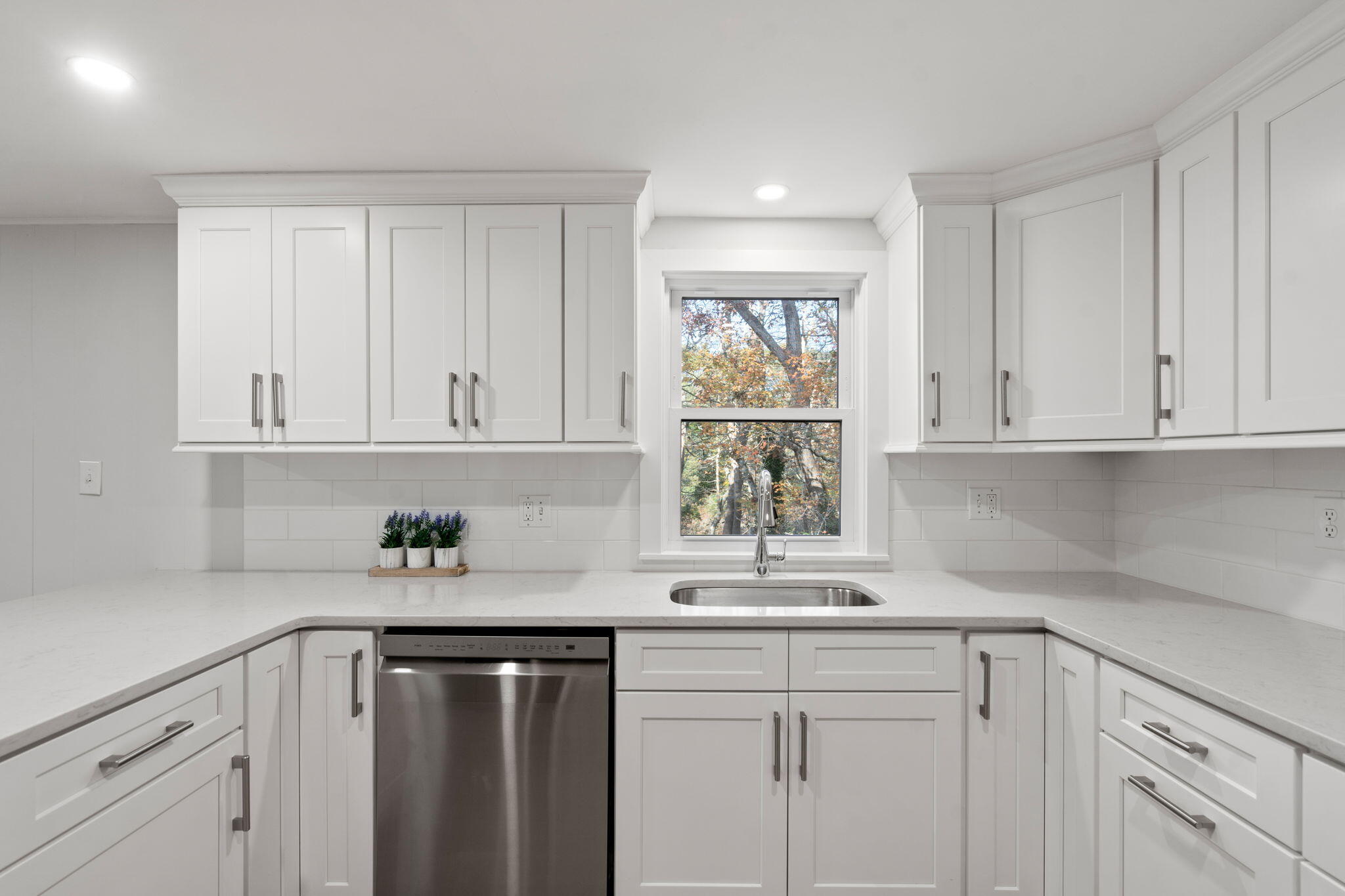 118 Fox Hill Road Centerville, MA 02632 - Photo 10 of 22 a kitchen with white cabinets and a window