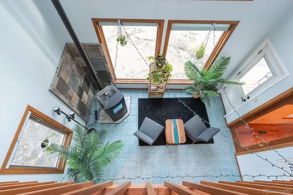 a view of a house with a yard covered in snow