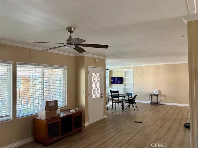 a view of a dining room with furniture and chandelier