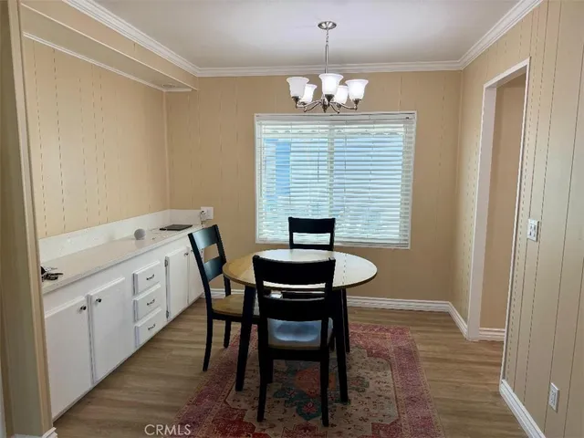 a view of a kitchen with a sink stove and refrigerator