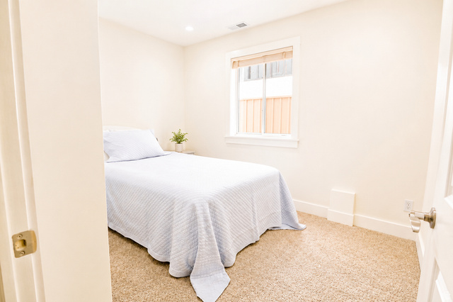1055 North 1000 East Mapleton, UT 84664 - Photo 59 of 112 Bright room featuring neutral-toned carpet, a window with a wood-finish blind, white trim, and a recessed ceiling light