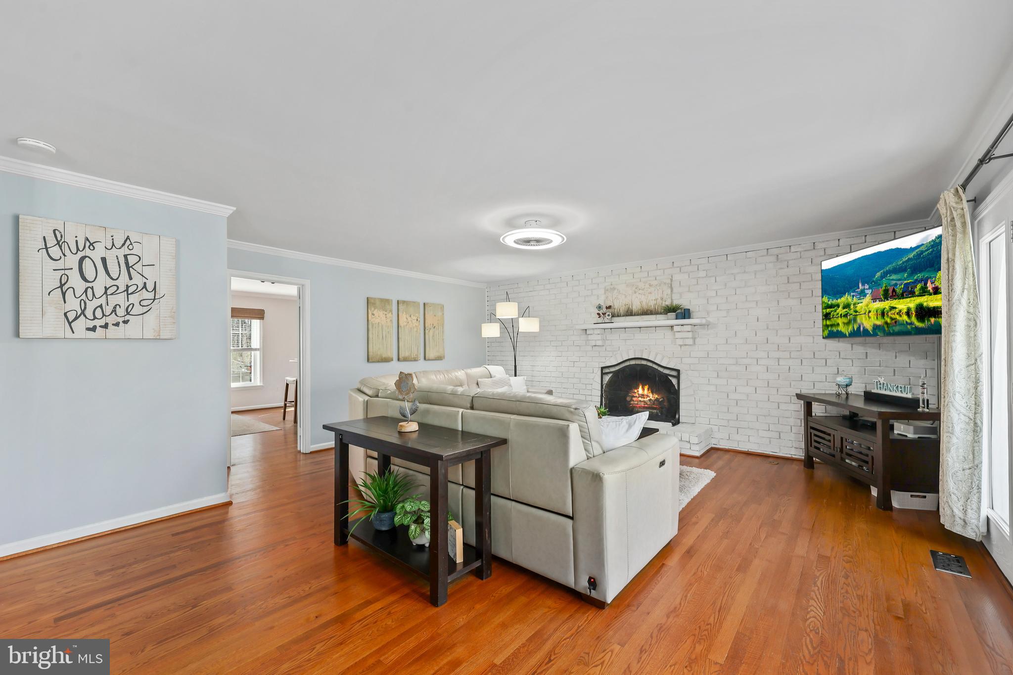 5024 Pheasant Ridge Road Fairfax, VA 22030 - Photo 9 of 51 Living Room with Gas Fireplace & Hardwood Floors