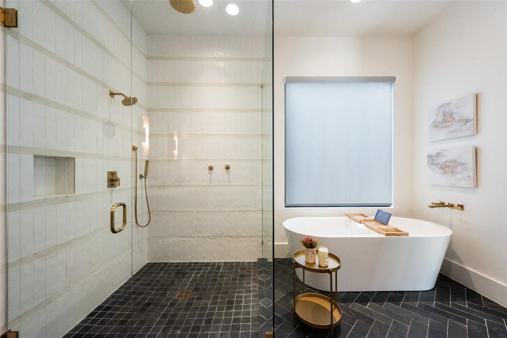 6443 Kenwood Avenue Dallas, TX 75214 - Photo 18 of 21 Bathroom featuring a shower stall, a freestanding tub, and tile patterned flooring