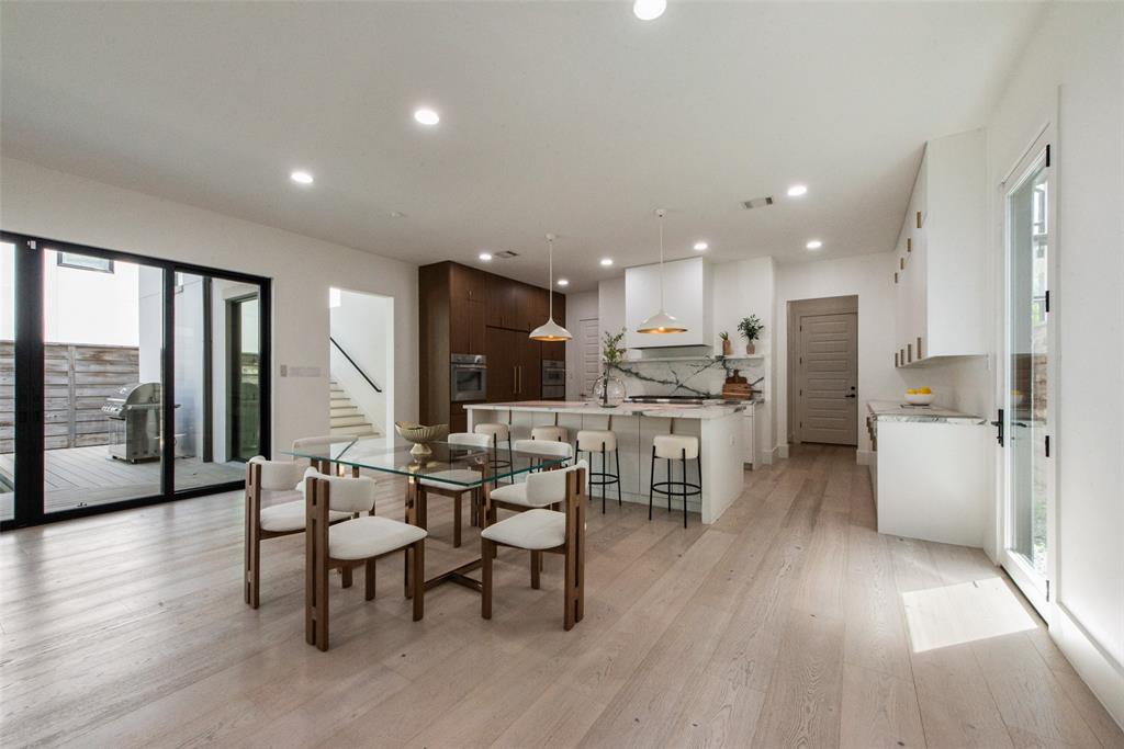 6443 Kenwood Avenue Dallas, TX 75214 - Photo 5 of 21 Dining space featuring light wood-style floors, healthy amount of natural light, stairs, and recessed lighting
