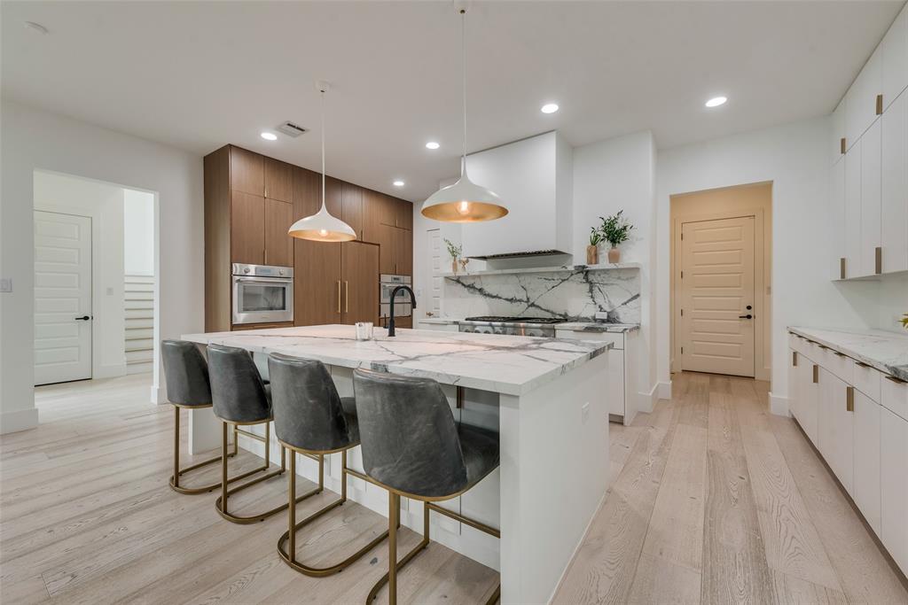 6443 Kenwood Avenue Dallas, TX 75214 - Photo 6 of 21 Kitchen featuring modern cabinets, stainless steel oven, light wood finished floors, and recessed lighting