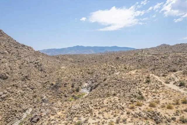 a view of a large body of water and mountains