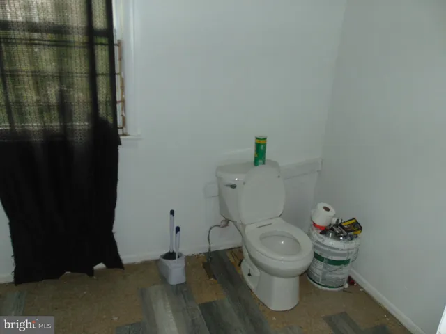 a kitchen with sink and a refrigerator