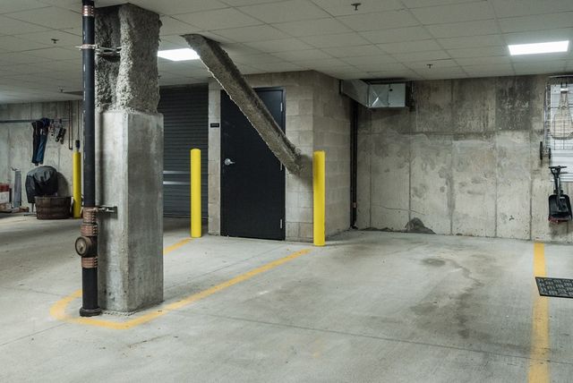 a view of a hallway with wooden walls