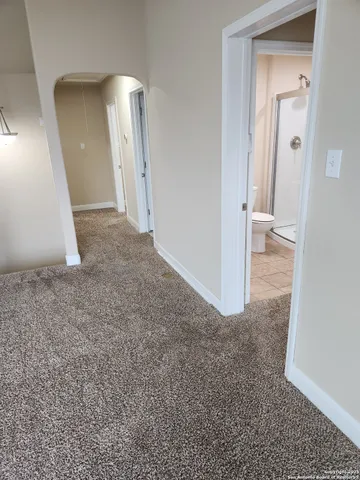 an empty room with a fireplace