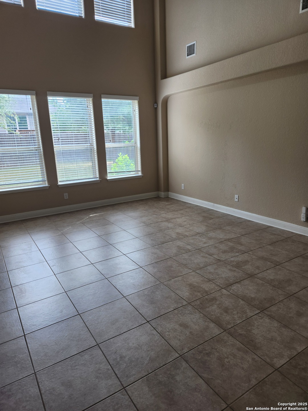 1806 Ayleth Avenue San Antonio, TX 78213 - Photo 7 of 16 a view of an empty room with a window