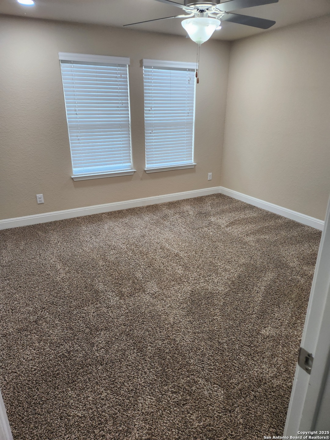 1806 Ayleth Avenue San Antonio, TX 78213 - Photo 9 of 16 an empty room with a empty space and windows