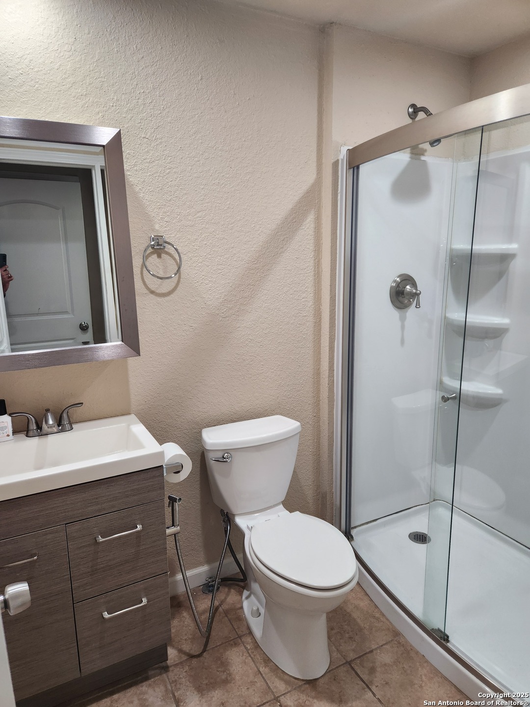 1806 Ayleth Avenue San Antonio, TX 78213 - Photo 10 of 16 a bathroom with a toilet sink vanity and shower