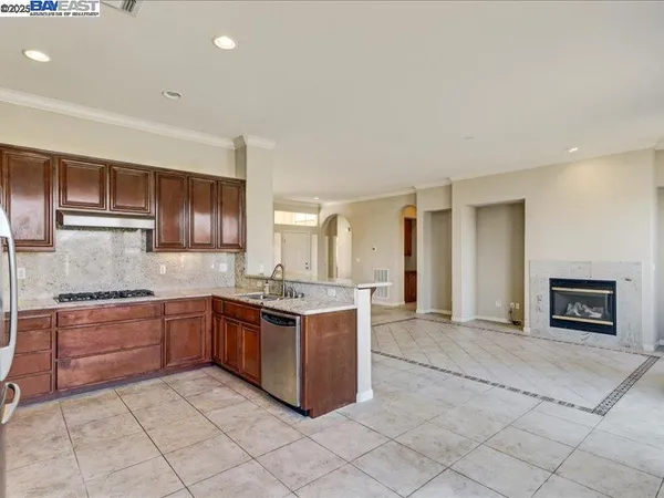 a kitchen with a window and refrigerator