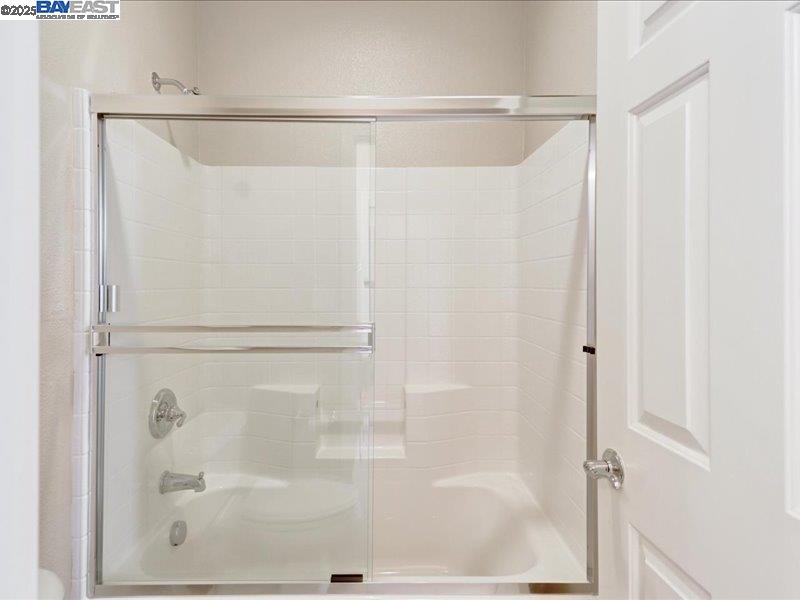 Rio Vista Rio Vista, CA 94571 - Photo 20 of 30 a bathroom with a glass shower door