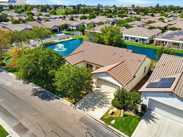 an aerial view of a house with a garden