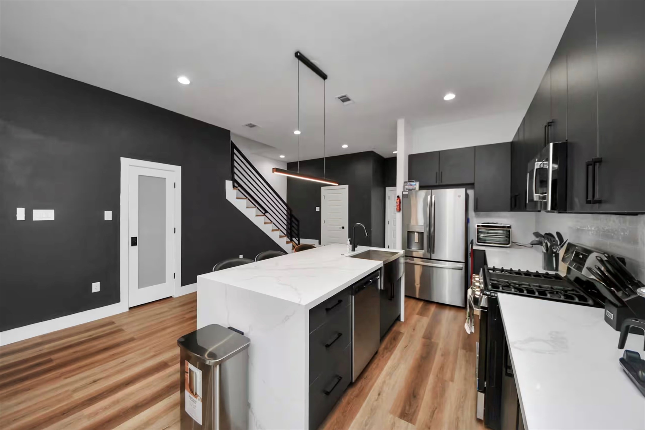 3521 Mainer Street Houston, TX 77021 - Photo 8 of 37 a kitchen with stainless steel appliances a refrigerator and a stove top oven