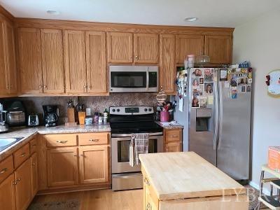 4832 Salem Road Spout Spring, VA 24593 - Photo 8 of 16 a kitchen with a refrigerator stove and microwave