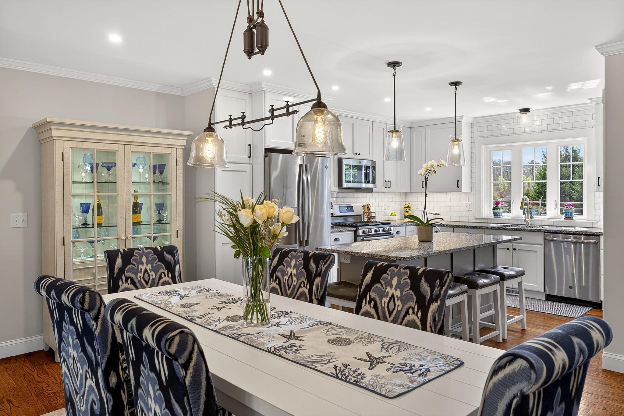 176 Bumps River Road Osterville, MA 02655 - Photo 11 of 54 a dining room with furniture a rug and a chandelier