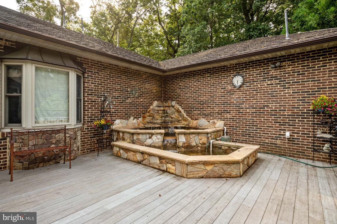 1528 Stringtown Road Berryville, VA 22611 - Photo 67 of 85 Beautiful Stone Pond & Waterfall on Rear Deck