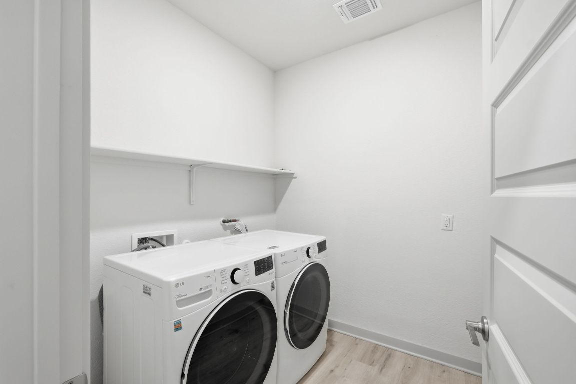 10912 Fulton Avenue Austin, TX 78754 - Photo 10 of 15 a utility room with dryer and washer