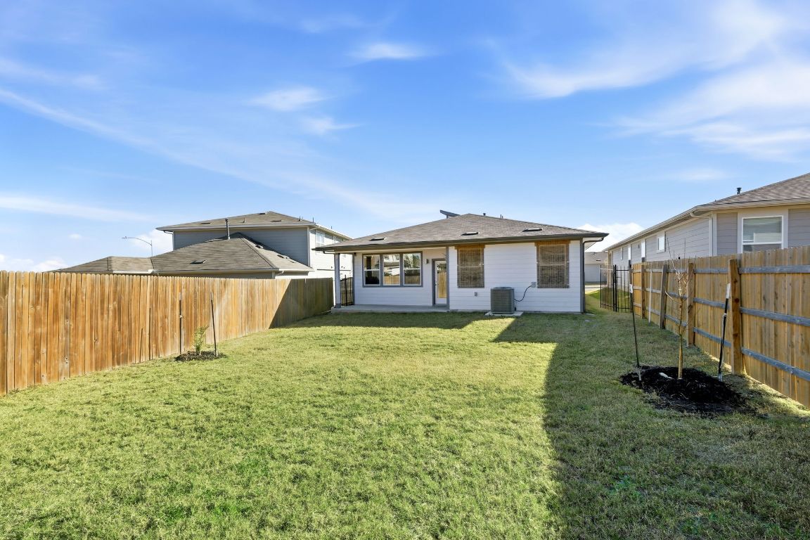10912 Fulton Avenue Austin, TX 78754 - Photo 12 of 15 a front view of a house with garden