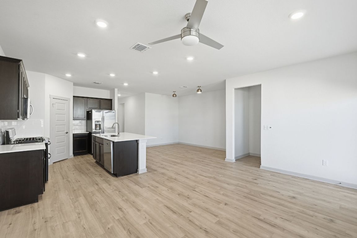 10912 Fulton Avenue Austin, TX 78754 - Photo 2 of 15 a view of kitchen with wooden floor